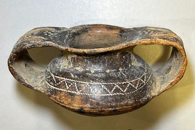 A Brown Burnished Terracotta Pot. Villanova culture, Italy, 8th - 7th century BCE. 8 5m high 