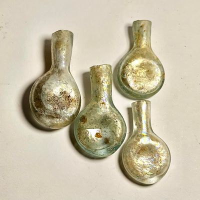 A Lot of 4 Islamic Glass Ampulae. 12th - 13th century CE. 4.9 - 3.9 cm high. In Very Good 