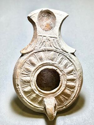 A Jewish Southern Type Terracotta Oil Lamp. 1st - 2nd century CE. 9.2 cm. Decorated with egg 