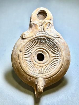 A Phoenician Type Terracotta Oil Lamp. 1st - 2nd century CE. 10 cm. Decorated with a linear 