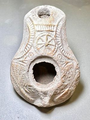 A Samaritan Terracotta Oil Lamp. 4th century CE. 8.8 cm. With geometric and floral decorations 