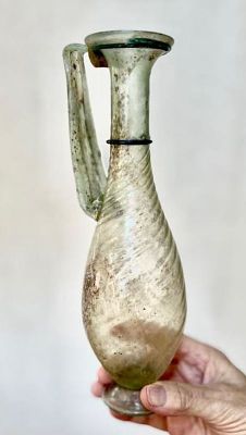 A Roman Tall Translucent Glass Jug, . 4th century CE, With two turquoise ring decorations arroud 