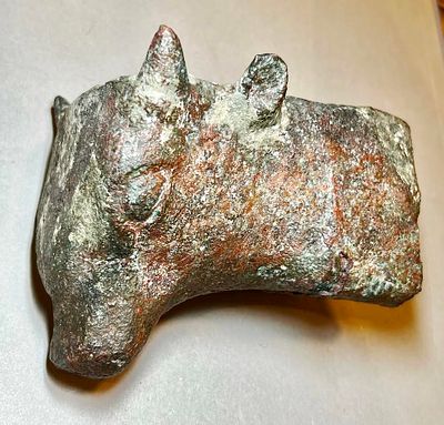 A Large Bronze Bull Head. 1st millennium BCE, 11.4 cm; 1.130 Kg. Probably a furniture feeting. 