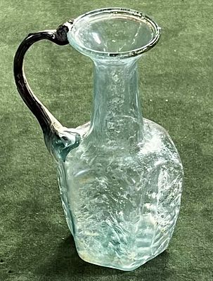 A Translucent Glass Hexagonal Jug. Byzantine Period, 5th century CE. 13.0 cm high. Blown in a 