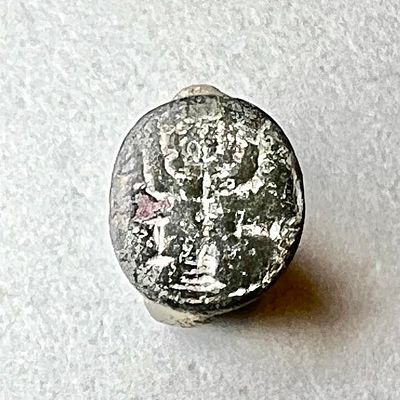 A Bronze Ring Depicting a Seven Branched Menorah flanked by an Altar and a Shovel?. Early Roman 