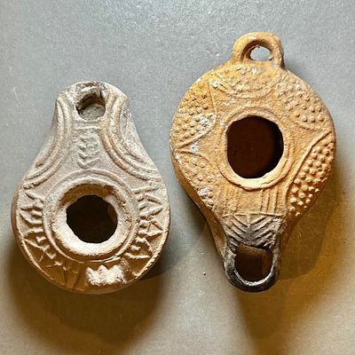 A Lot of 2 Samaritan Terracotta Oil Lamps. 4th century CE. 9.2 and 7.7 cm. Decorated with 