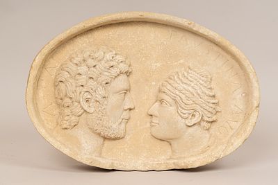 Provincial Roman Stone Plinth, ellypse shape with posthume double portrait of Cesare (100 – 44 