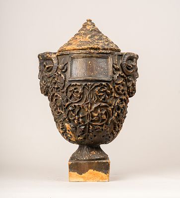 Roman Funeral Urn, with peaked lid. Two masks. Terracotta sculpted with rich floral 