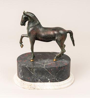 Venetian Bronze Horse, in walking position. Bronze cast with original patina. On oval marble 