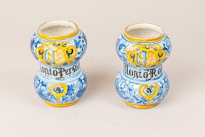 Two Albarello, bombed shape with flowers and coat of arms painted on blue ground , ceramic 