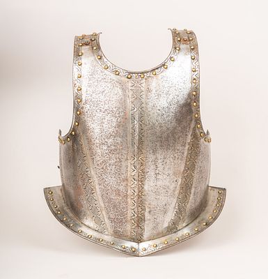 Breast Armor, polished and hammered stil with decorations and bronze knox. Central neele. 