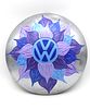 Hand-Painted Volkswagen Hubcap with Blue and Purple Flower Design. A silver hubcap, decorated Image - 1