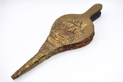 Brass Fireplace Bellows with Embossed Sailing Ship Design. A brass fireplace bellows with an 