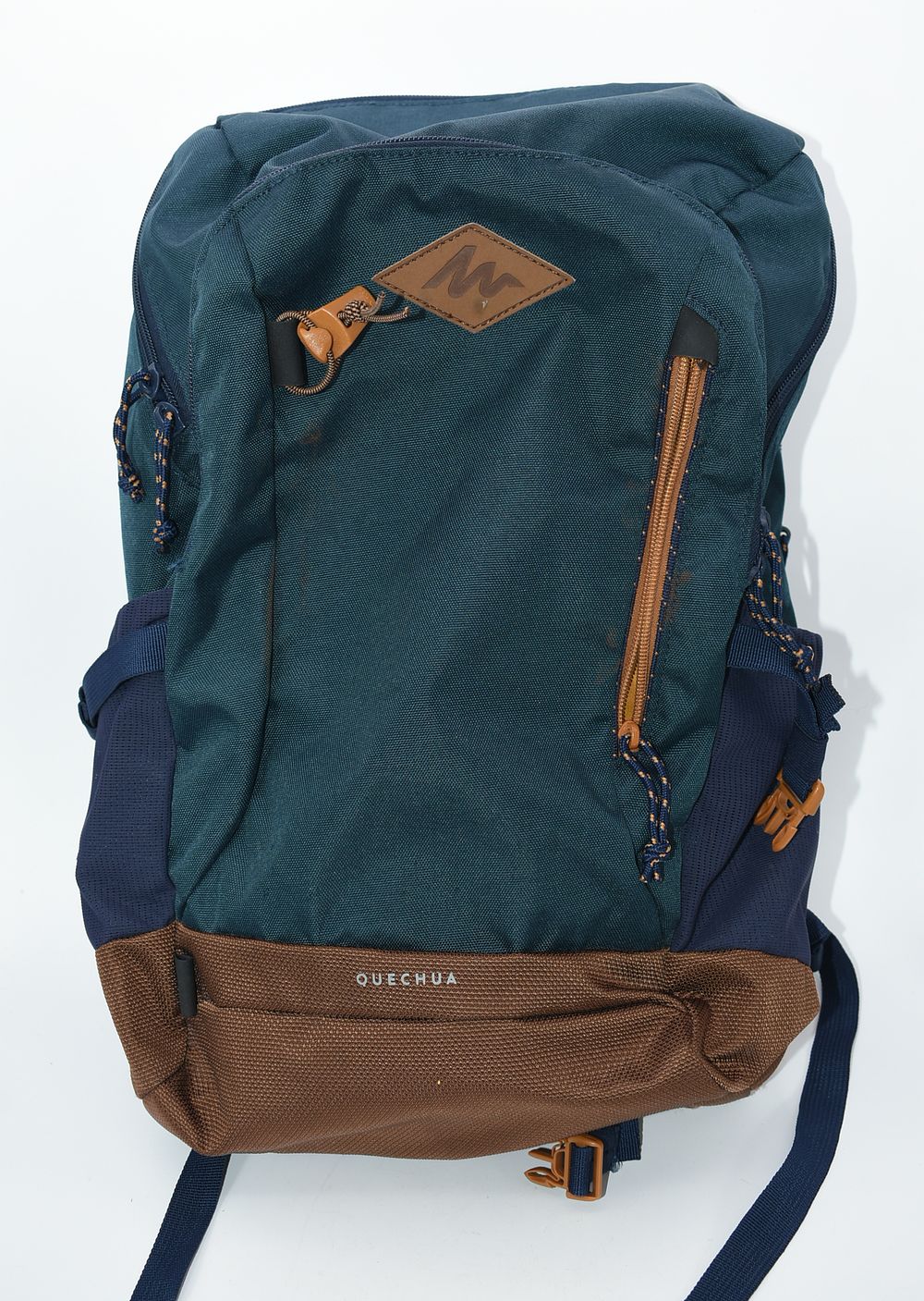 Quechua 20L Hiking Backpack in Teal, Navy, and Brown. A Quechua 20L hiking backpack in dark teal 