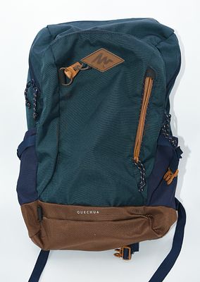 Quechua 20L Hiking Backpack in Teal, Navy, and Brown. A Quechua 20L hiking backpack in dark teal 