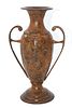 Rustic Patinated Metal Urn Vase with Handles. A rustic reddish-brown urn or vase with dark brown Image - 1