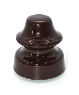 One Vintage Dark Brown Glazed Ceramic Insulator. A dark brown, glazed ceramic insulator 
