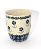 Hand Made Polish Pottery Blue Daisy Floral Mug. A cream-colored ceramic mug, approximately 4.25" Image - 1