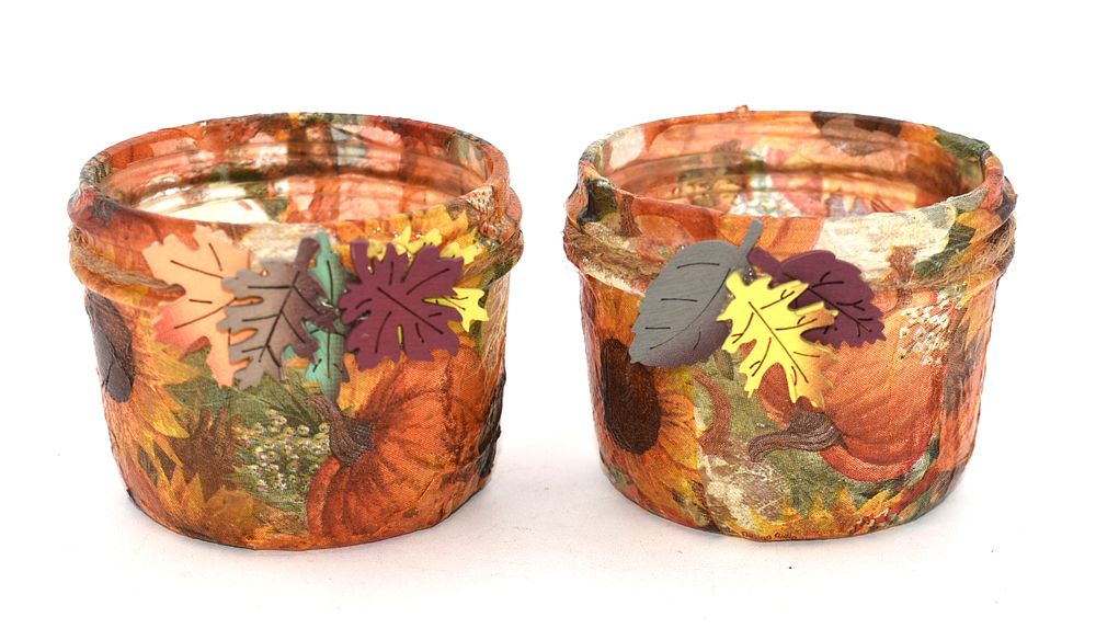 Two Autumn-Themed Decorative Glass Jars with Candles. Two autumn-themed decorative glass jars 