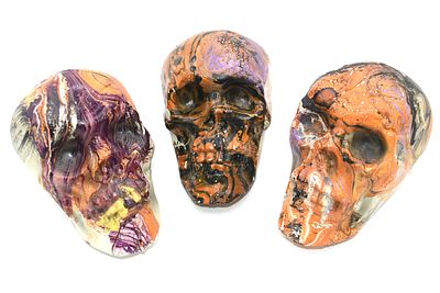 Three Decorative Hydro-Dipped Plastic Skulls. Three hydro dipped plastic skulls predominantly 