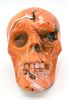 Two Orange and Black Swirl Decorative Skull Figures. Two decorative skull figures, one Image - 1