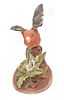 Royal Crown bird figurine. A single reddish-orange and gray porcelain bird figurine with spread Image - 1