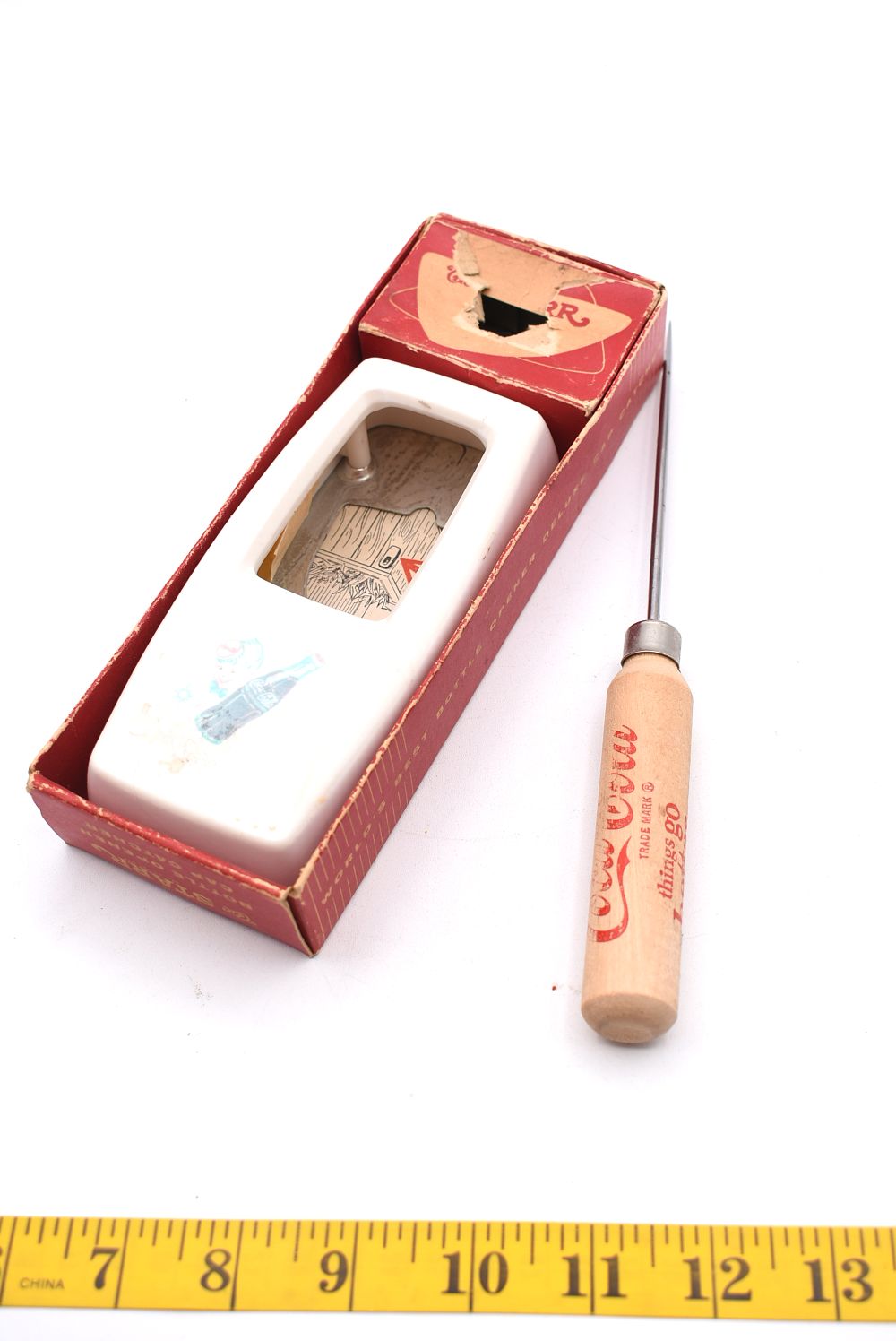 Coca-Cola The STARR Bottle Opener, Box, and Ice Pick. A white wall-mounted "The STARR" bottle 