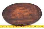 Hand Carved Oval Wooden Plaque or Trivet. A dark brown oval wooden plaque or trivet with carved Image - 1