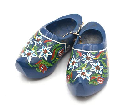 Pair of Dark Blue Hand-Painted Wooden Dutch Clogs with Floral Design. A pair of dark blue wooden 