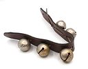 Five Silver-Colored Metal Sleigh Bells on Leather Strap. Five silver-colored metal sleigh bells Image - 1