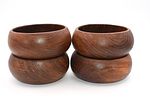 Set of Four Vintage Teak Wood Salad Bowls. A set of four dark brown wooden bowls, likely teak Image - 1