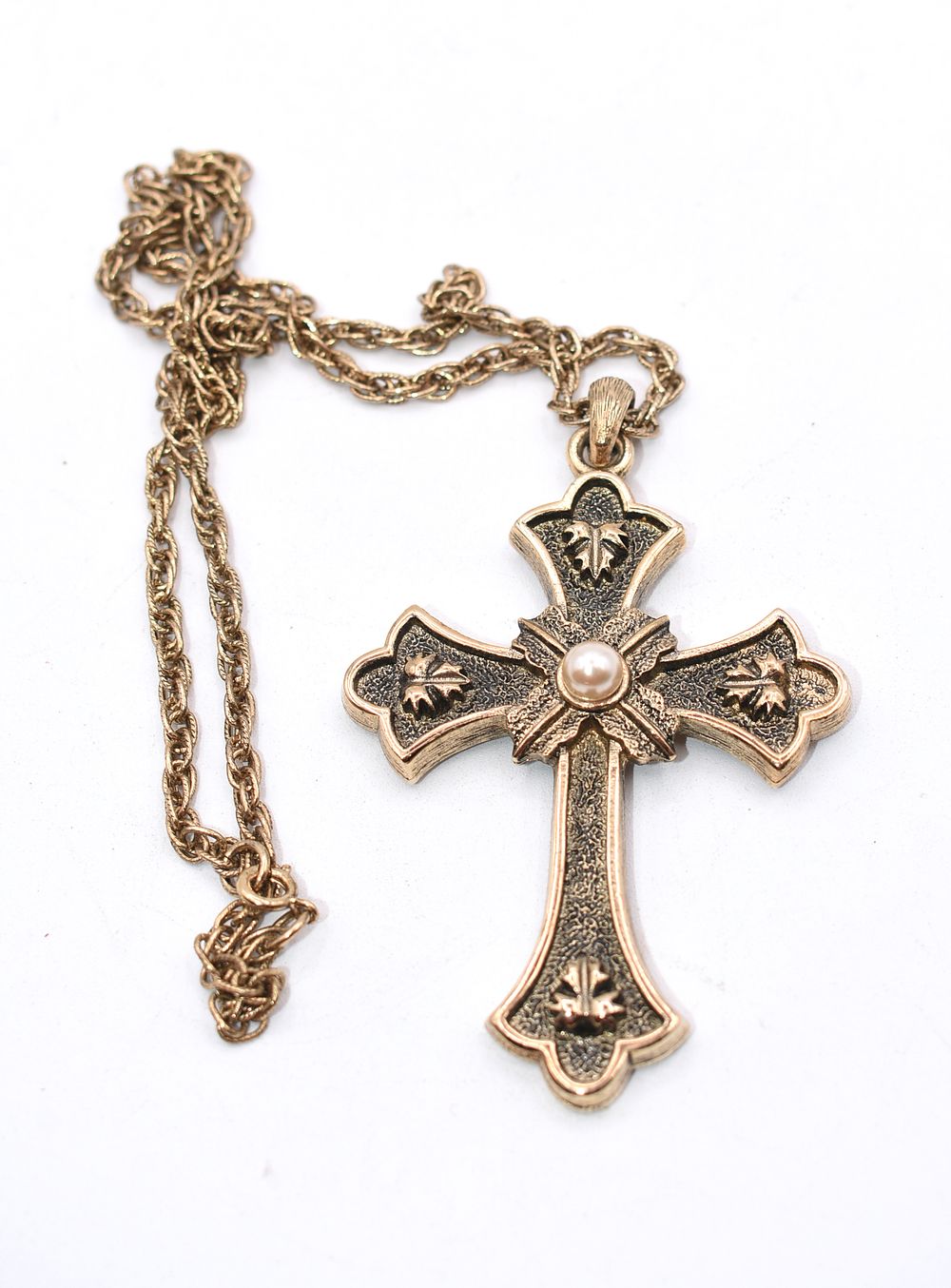 Sarah Coventry 1975 Limited Edition Pearl Cross Necklace. A gold/bronze-toned cross pendant 