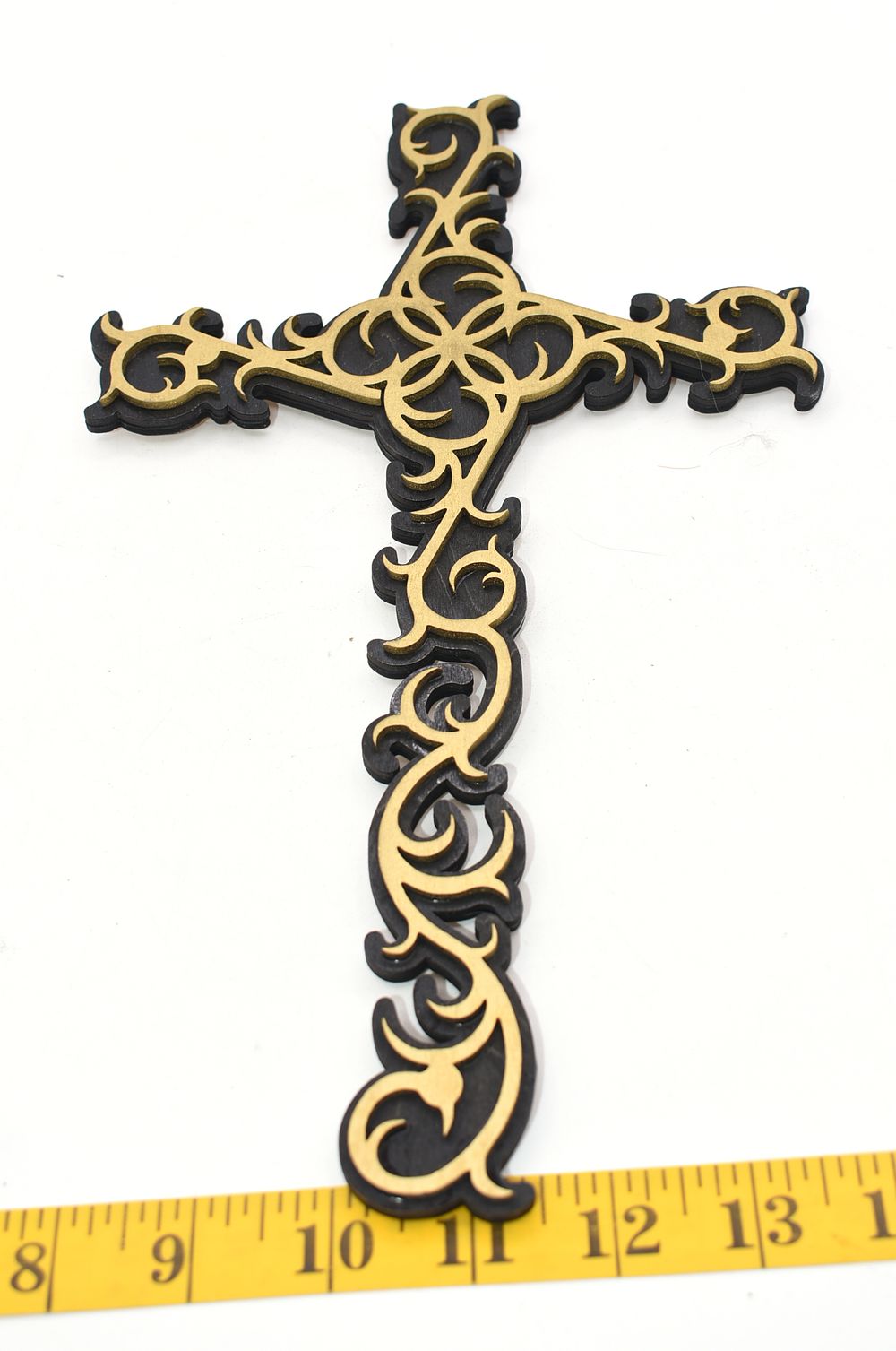 A laser cut wooden Two-Tone Decorative Cross with Scrollwork. An ornate, two-tone decorative 