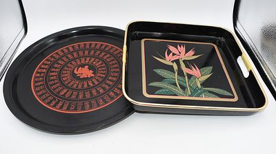 A Pair of Black Floral and Chinese Character Serving Trays. A pair of black serving trays, one 