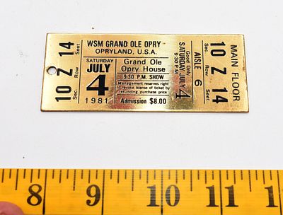 Vintage Grand Ole Opry Brass Ticket Keychain 1981. A single golden-colored brass plaque 