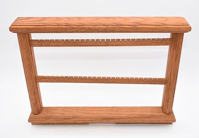 Brown Wooden Two-Bar Earring Display Stand. A brown wooden earring display stand features two 