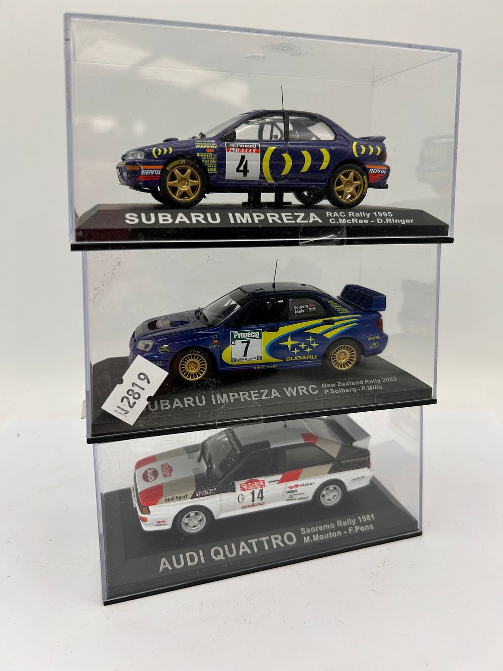 Lot 250: Three Die-Cast Rally Cars In Perspex Boxes.