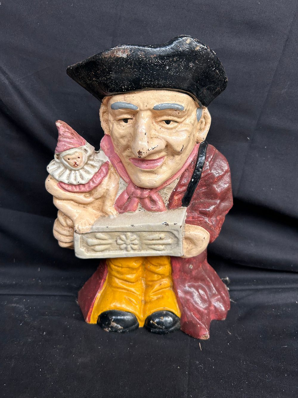 Lot 335: Early Punch and Judy Cast Iron Door Stop...
