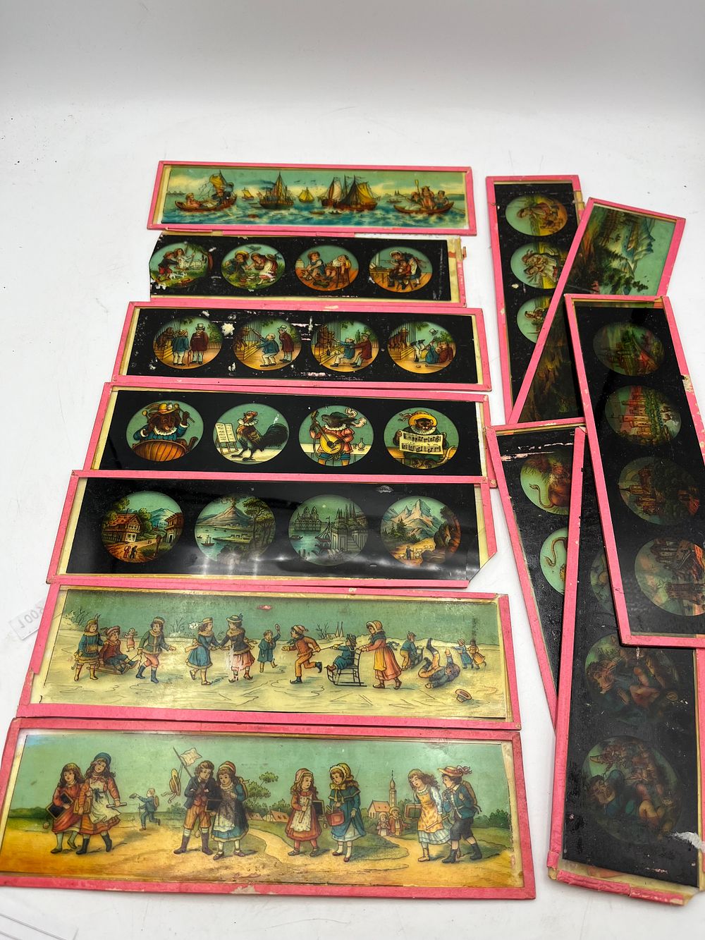 Lot 369: Vintage Glass Slides Including Nursery Rhymes.