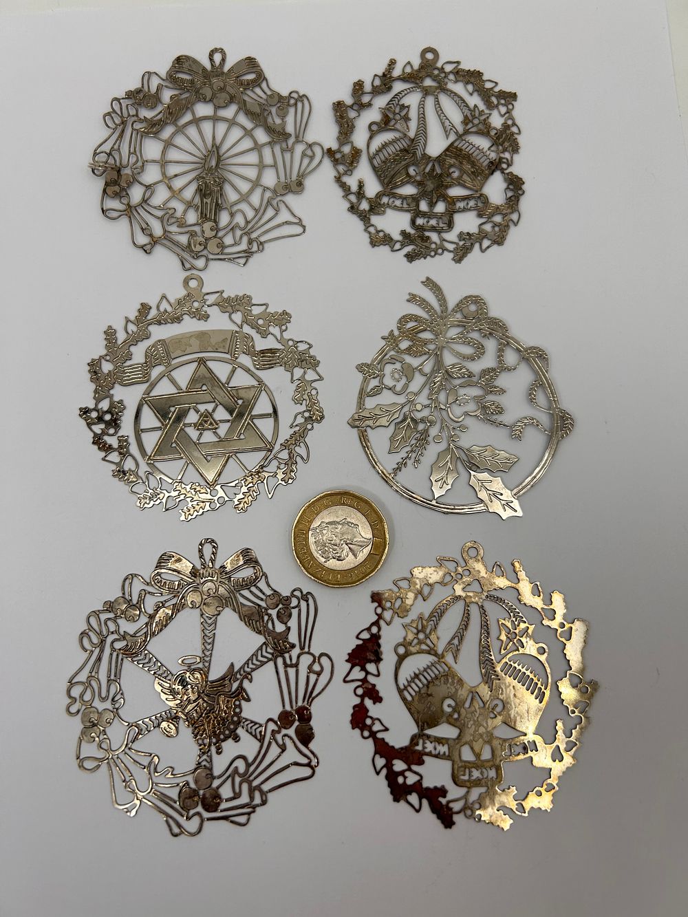 Lot 182: Set Of Six Silver Laser Cut Christmas Decorations.