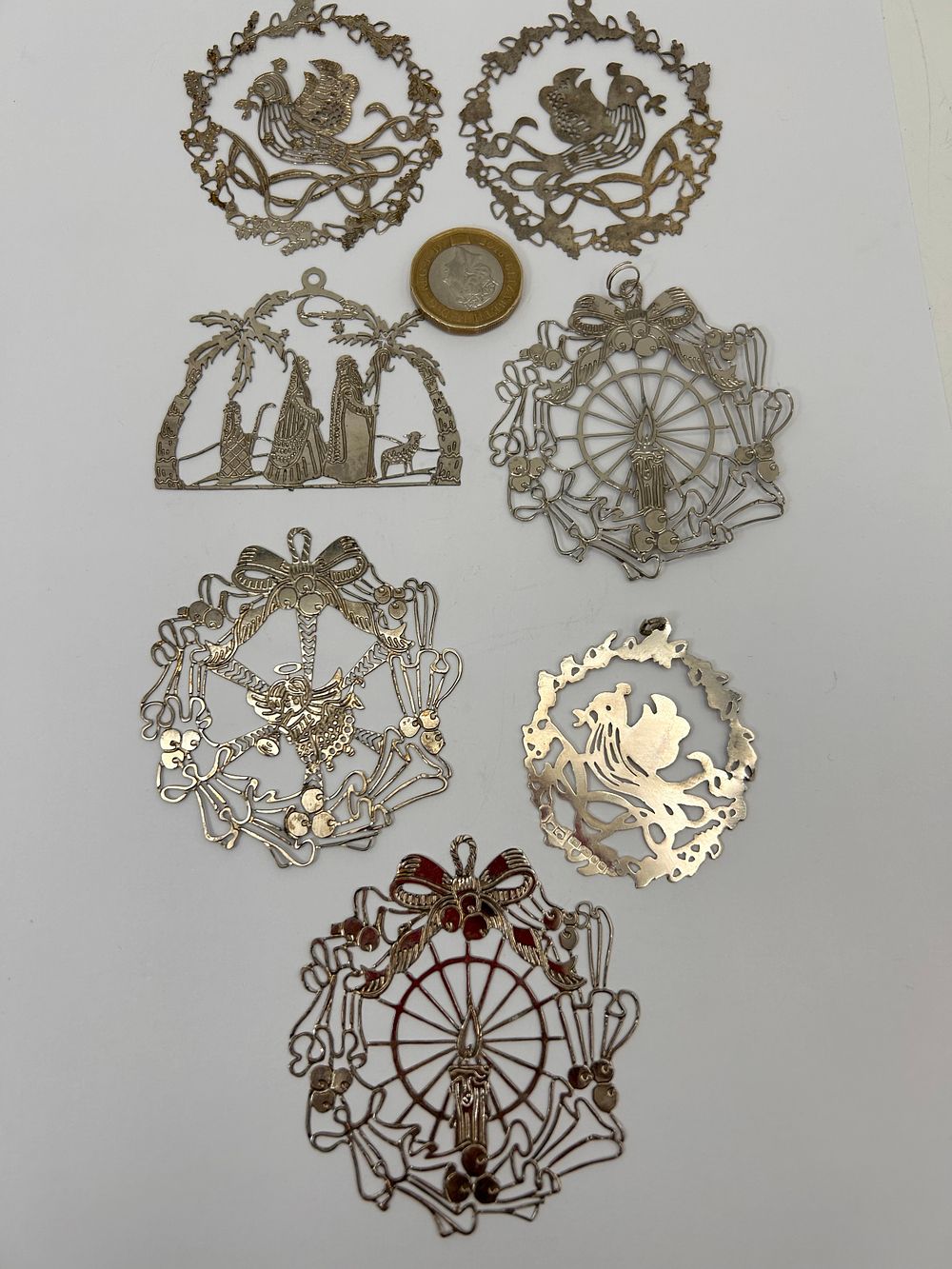 Lot 184: Set Of Seven Silver Laser Cut Christmas Decorations.