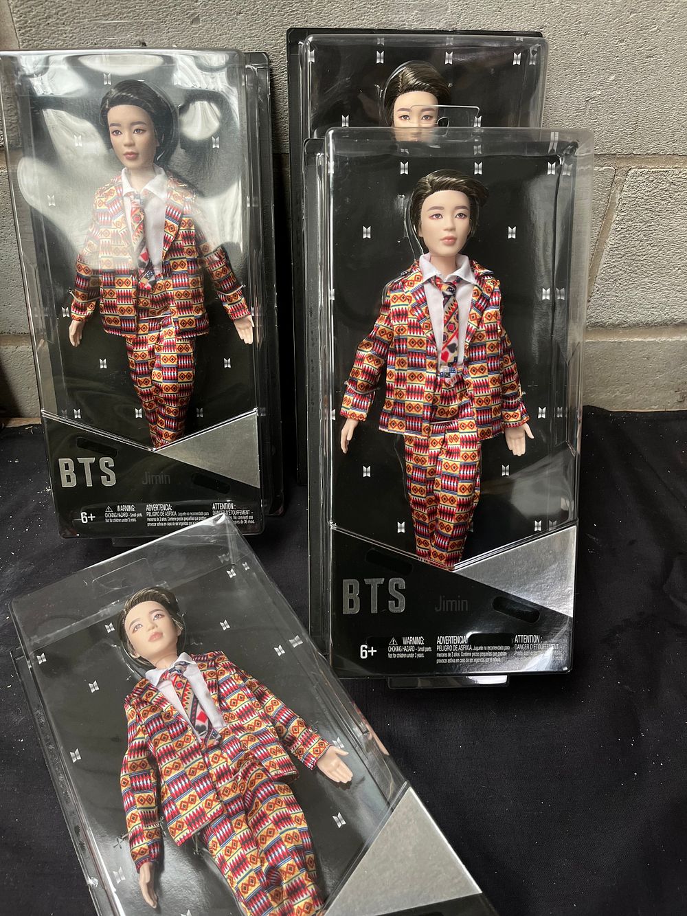 Lot 219: Four New In Box BTS 'Jimin' Dolls.