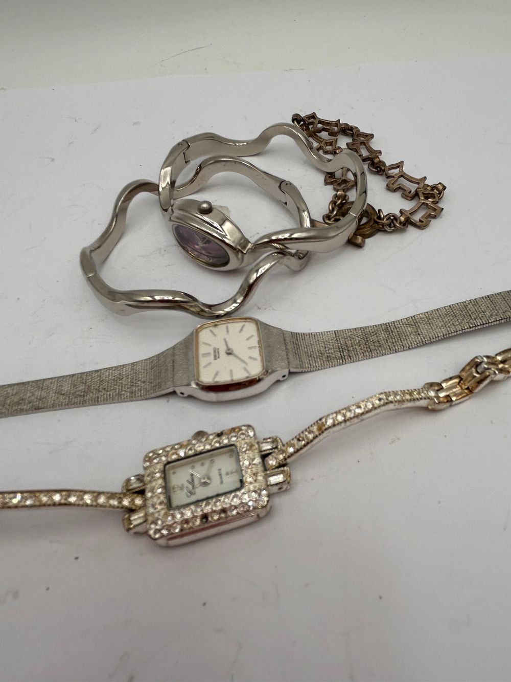 Lot 335: Small Collection Of White Metal Watches And Bracelets.