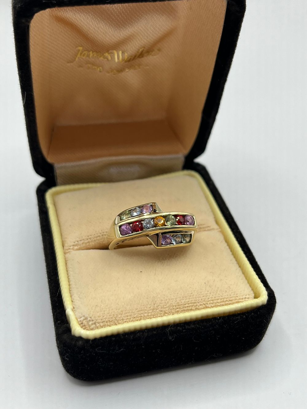 Lot 316: 9ct Yellow Gold Channel Set Sapphire Rainbow Ring...