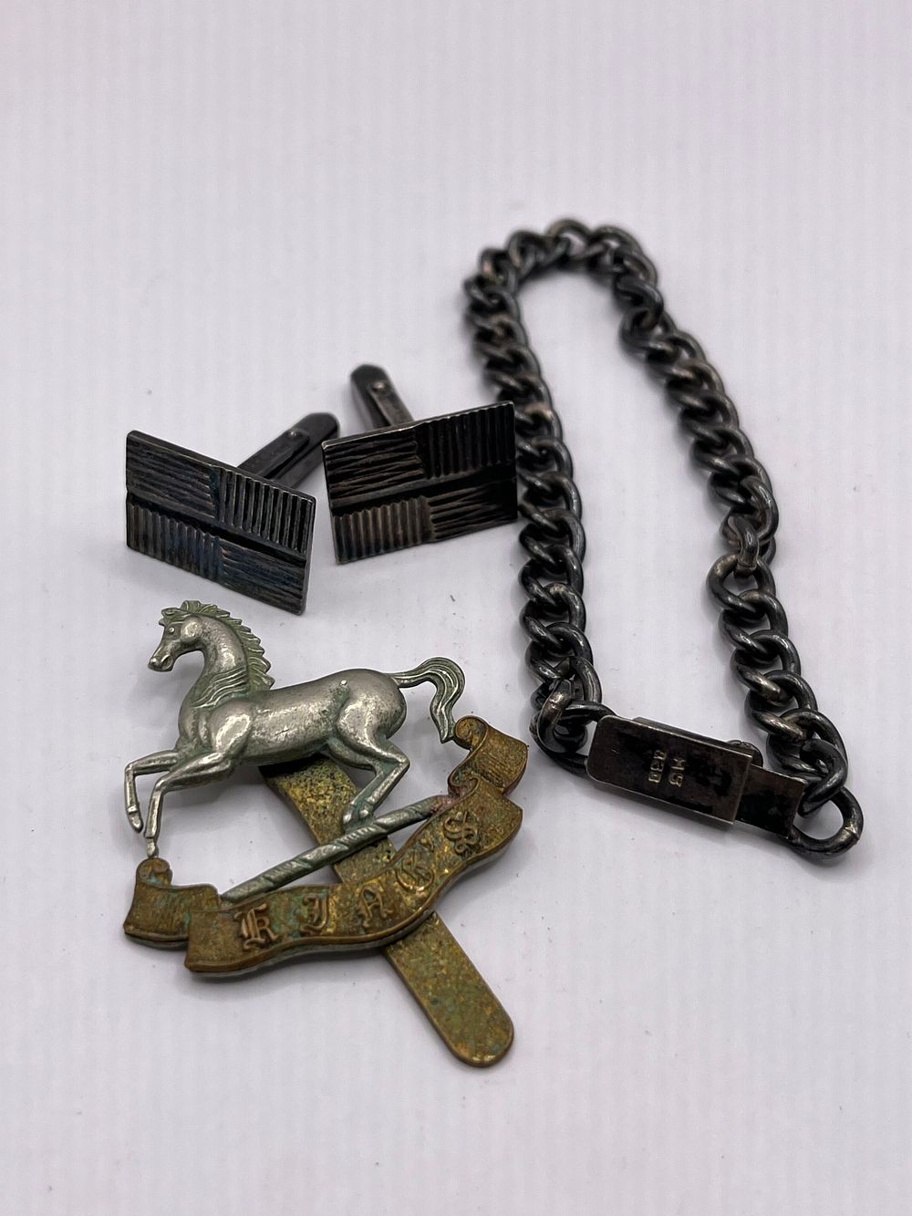 Lot 327: Military Cap Badge And Silver Cuff-links And Bracelet.