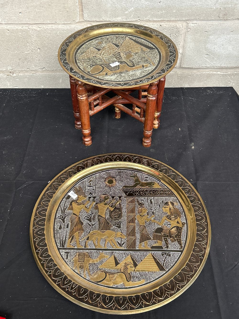 Lot 492: Brass Table and Wall Charger Egyptian Themed