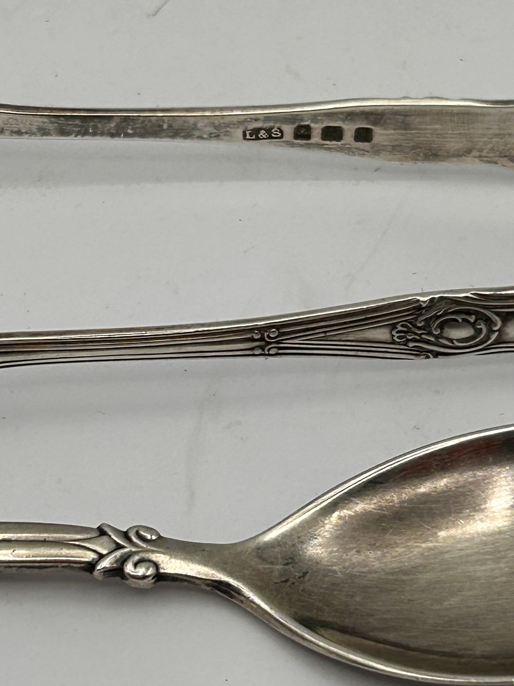 Lot 359: A Collection of Seven Decorative Silver-Colored Utensils, including Sterling Silver Tongs