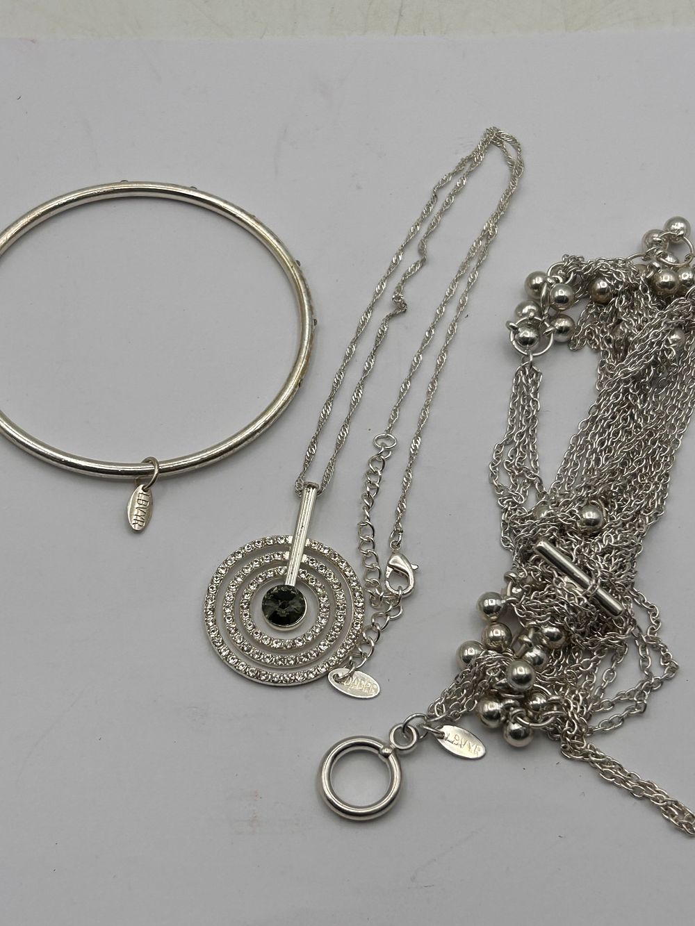 Lot 367: Three Pieces of AVON Silver-Tone Costume Jewelry