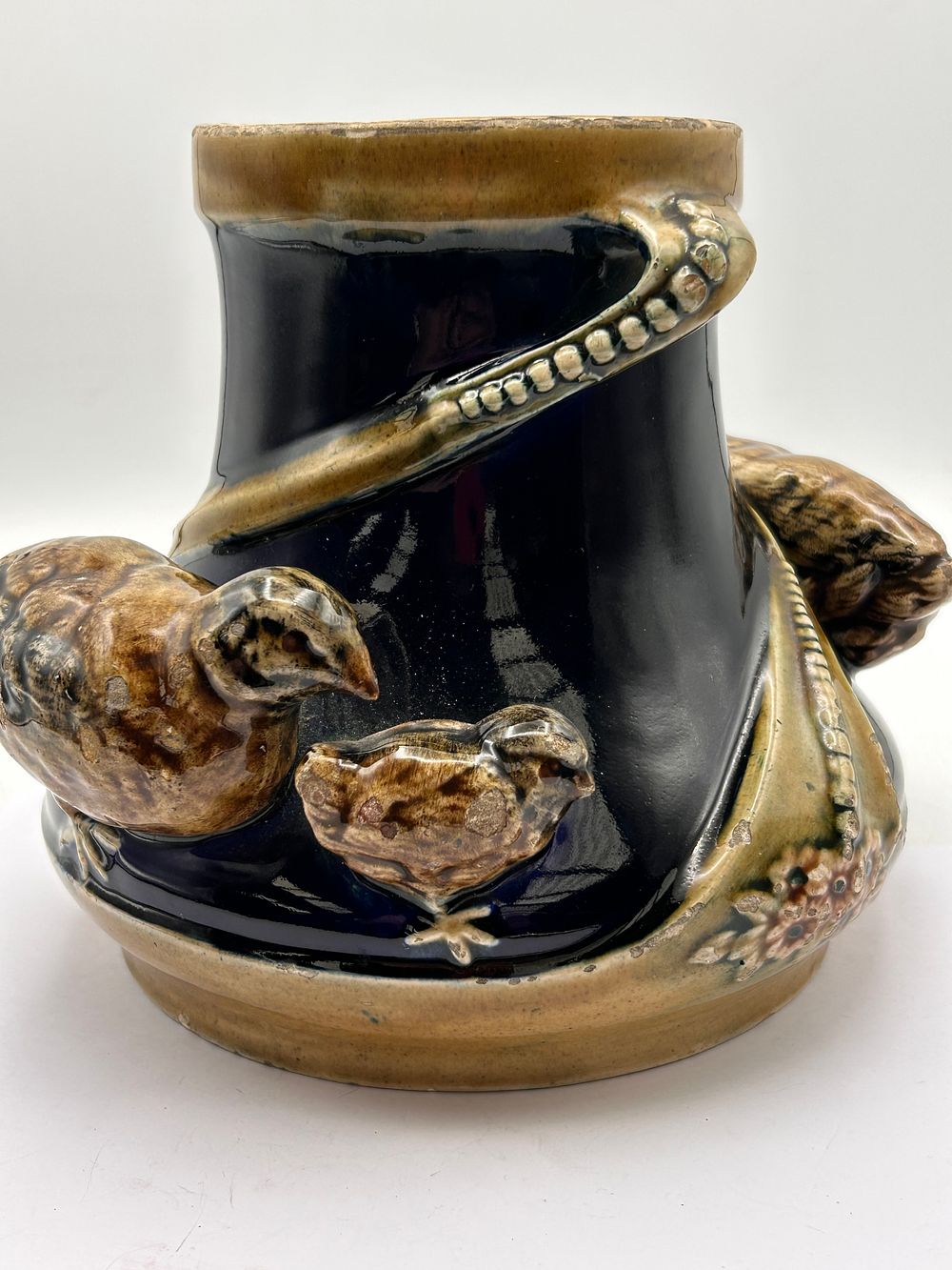 Lot 379: A Glazed Ceramic Vase with Relief Birds and Coiled Decoration, 7” Tall