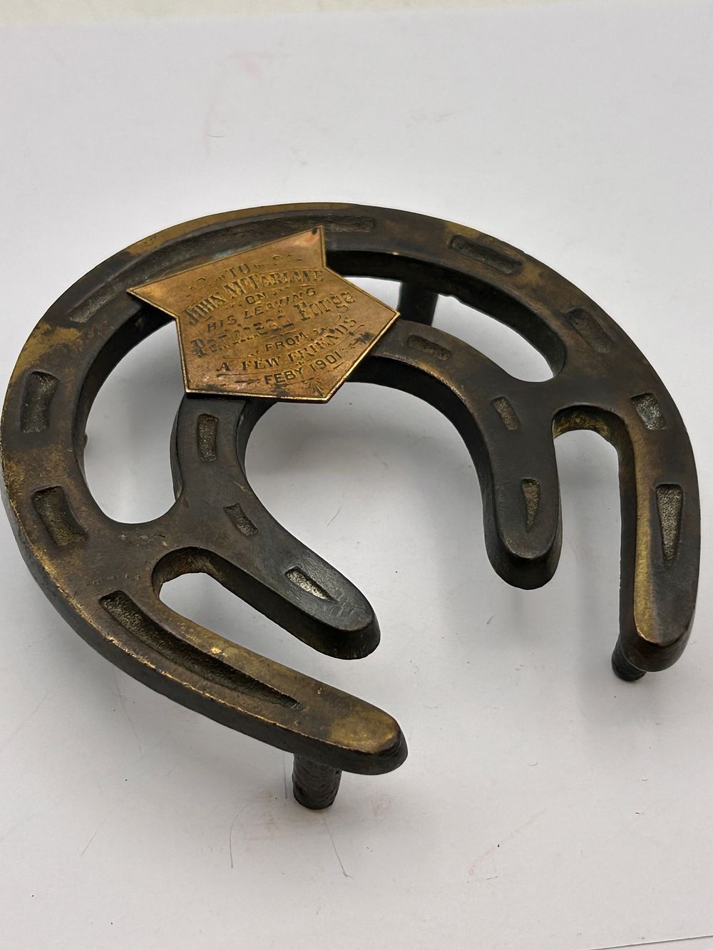 Lot 381: Early 20th Century Commemorative Cast Iron and Brass Horseshoe Trivet/Desk Ornament, Dated 1901
